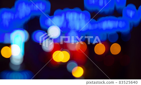 Colored blurred bokeh. abstract background of included festive garlands. colorful blur light bulbs Colored blurred bokeh. abstract background of included festive garlands. colorful blur light bulbs 83525640