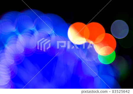 Colored blurred bokeh. abstract background of included festive garlands. colorful blur light bulbs Colored blurred bokeh. abstract background of included festive garlands. colorful blur light bulbs 83525642