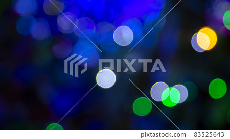 Colored blurred bokeh. abstract background of included festive garlands. colorful blur light bulbs Colored blurred bokeh. abstract background of included festive garlands. colorful blur light bulbs 83525643