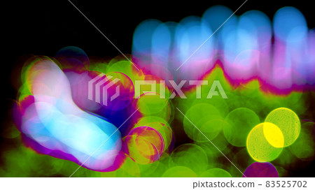 Colored blurred bokeh. abstract background of included festive garlands. colorful blur light bulbs 83525702