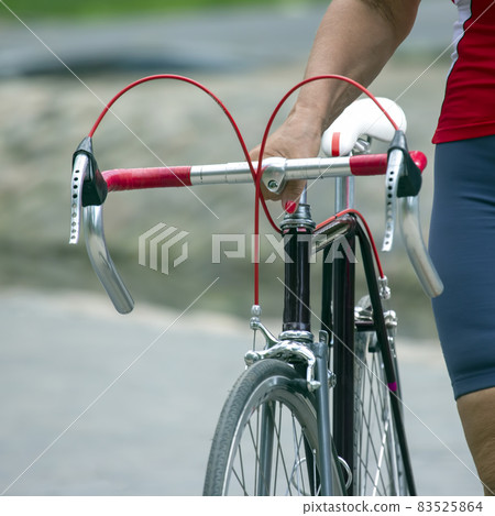 sports bike in the hands of a woman. recreation and sports lifestyle sports bike in the hands of a woman. recreation and sports lifestyle 83525864