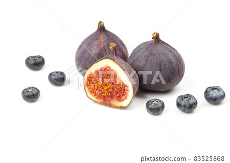 fresh figs and blueberries on a white background. Vitamin products fresh figs and blueberries on a white background. Vitamin products 83525868
