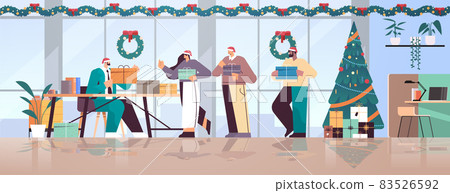 colleagues in santa hats holding gifts mix race businesspeople celebrating new year christmas holidays in office 83526592