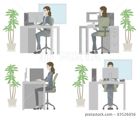 A woman who works a computer at the office A woman who works a computer at the office 83526856
