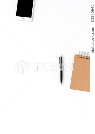 Elegant office desktop with smartphone, notebook and pen isolated on white background with copyspace. Modern workspace Elegant office desktop with smartphone, notebook and pen isolated on white background with copyspace. Modern workspace 83530646