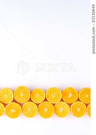 Orange slices on white background with copyspace 83530649