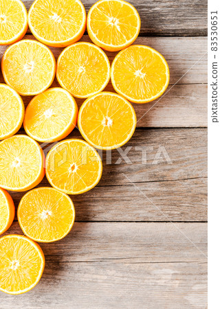 Overhead shot of fresh oranges on wooden background Overhead shot of fresh oranges on wooden background 83530651