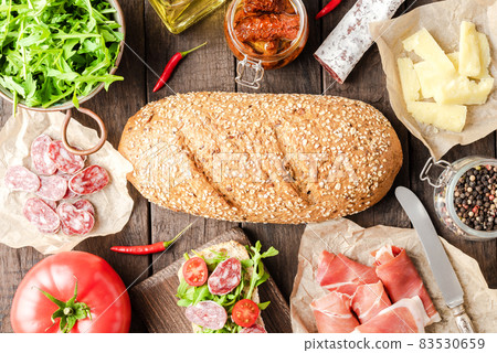 Italian appetizers on wooden table. Food background Italian appetizers on wooden table. Food background 83530659