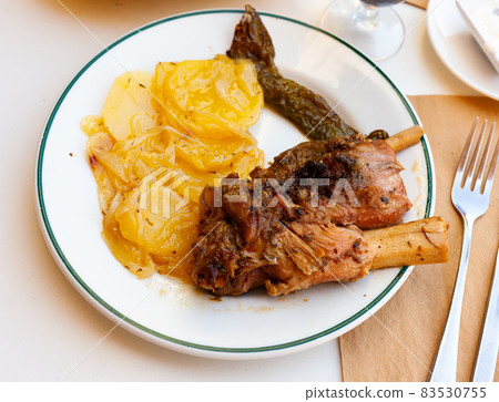 Delicious pork knuckle with potatoes Delicious pork knuckle with potatoes 83530755