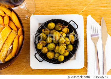 Pickled olives with a stone - a typical Spanish tapas. 83530757