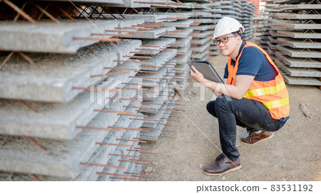 Asian worker using digital tablet at construction site 83531192