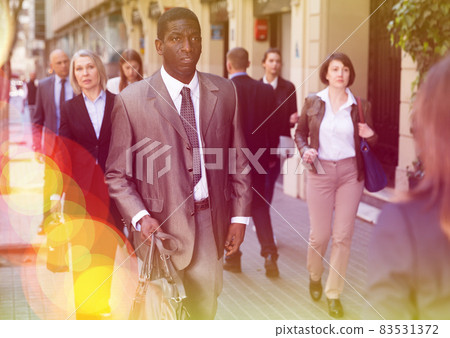 African businessman walking on street African businessman walking on street 83531372