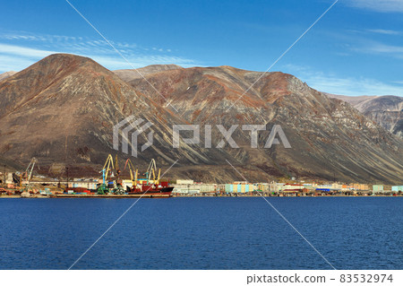 View of the small northern port town of Egvekinot, located on the shore of the Kresta Bay of the Bering Sea. View of the small northern port town of Egvekinot, located on the shore of the Kresta Bay of the Bering Sea. 83532974