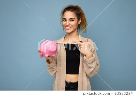 Portrait photo of happy positive smiling young beautiful attractive brunette curly woman with Portrait photo of happy positive smiling young beautiful attractive brunette curly woman with 83533284