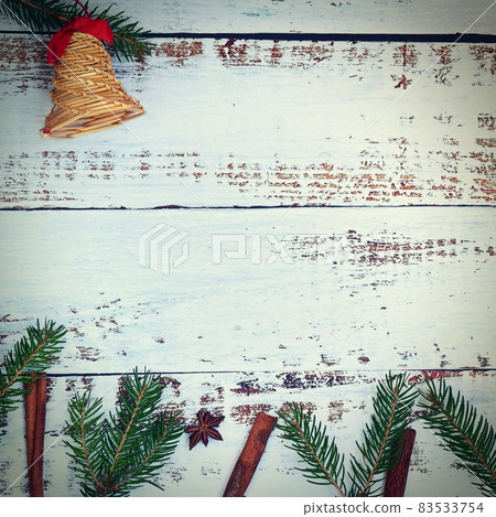 Christmas background. Beautiful decorations for the Christmas tree on a wooden white background. Concept for holidays and winter time with copy space. 83533754
