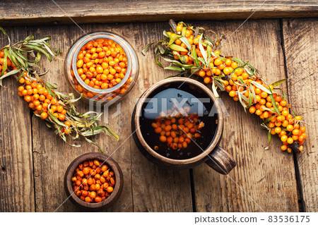 Tea with sea buckthorn berries Tea with sea buckthorn berries 83536175
