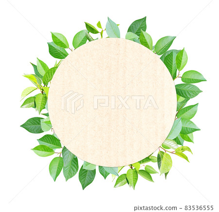Green leaves and round recycled paper label. Isolated on white background 83536555