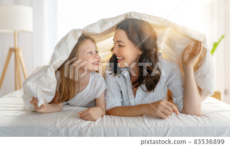 girl and her mother enjoying sunny morning 83536899