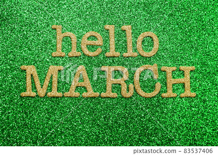 Hello March alphabet letters on green glitter background Hello March alphabet letters on green glitter background 83537406