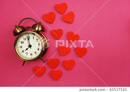 Vintage Alarm Clock and Red Heart with space copy on Pink Background Vintage Alarm Clock and Red Heart with space copy on Pink Background 83537583