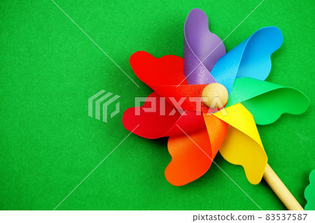 colorful pinwheel with space copy isolated on green background colorful pinwheel with space copy isolated on green background 83537587