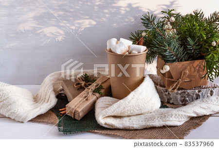 Cocoa with marshmallows, branches of a Christmas tree 83537960