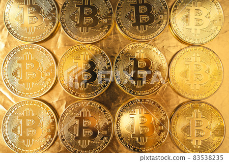 gold bitcoin on gold background gold bitcoin on gold background 83538235