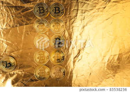 gold bitcoin on gold background gold bitcoin on gold background 83538236