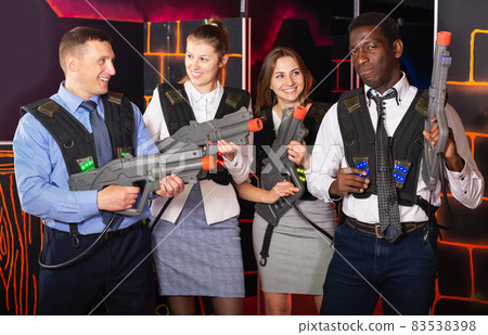 males and females in business suits posing at laser tag room males and females in business suits posing at laser tag room 83538398