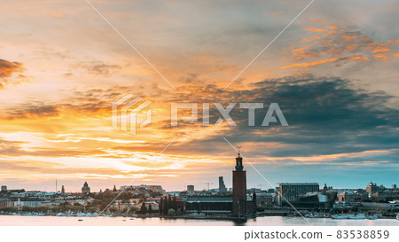 Stockholm, Sweden. Skyline Cityscape Famous View Of Old Town Gamla Stan In Summer Evening. Famous Popular Destination Scenic UNESCO World Heritage Site. Popular City Hall, Riddarholm Church In Sunset. Stockholm, Sweden. Skyline Cityscape Famous View Of Old Town Gamla Stan In Summer Evening. Famous Popular Destination Scenic UNESCO World Heritage Site. Popular City Hall, Riddarholm Church In Sunset. 83538859
