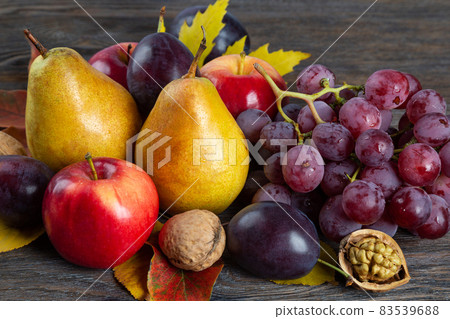 Autumn still life with fruit and nuts Autumn still life with fruit and nuts 83539688