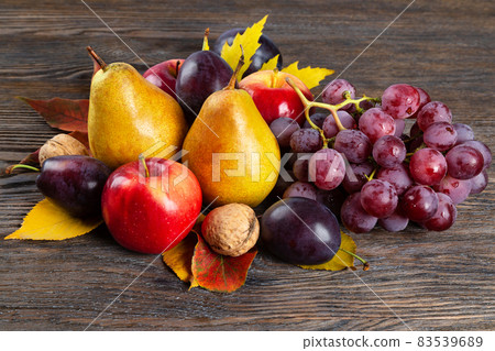 Autumn still life with fruit and nuts Autumn still life with fruit and nuts 83539689