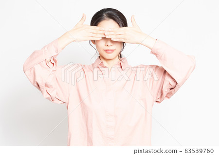 Woman hiding her eyes Woman hiding her eyes 83539760