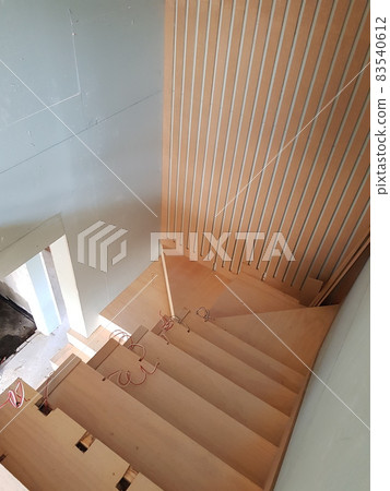 Construction site. Under construction. Woodwork. Light box. Wall, Perforated. Wooden stairs. 83540612