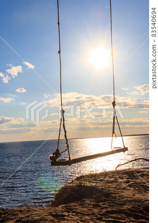 Rope swing on a shore of the Dnieper river in Ukraine Rope swing on a shore of the Dnieper river in Ukraine 83540694
