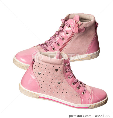 Children's sneakers are pink on a white background. Sports and casual shoes 83541029
