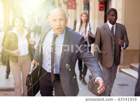 Portrait of hurrying man 83541939