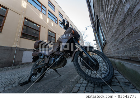 Rusted bikes parked on Scandinavian street corners 83542775