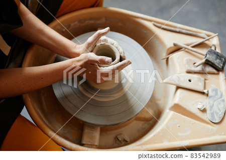 Female Hands Shaping Ceramics on Pottery Wheel 83542989