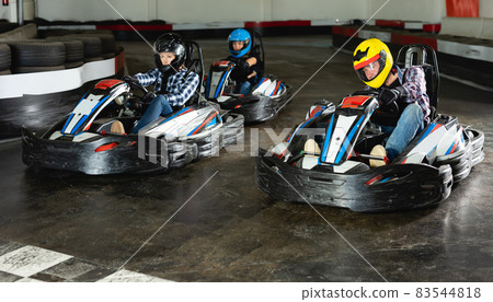 Group of happy male and females driving cars Group of happy male and females driving cars 83544818