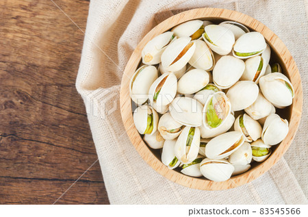 pistachio in shell nuts in bowl. pistachio in shell nuts in bowl. 83545566