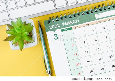 March 2022 desk calendar and diary with keyboard computer. 83545630