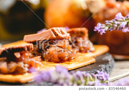 Onion jam with lavender flavor on crackers 83546460