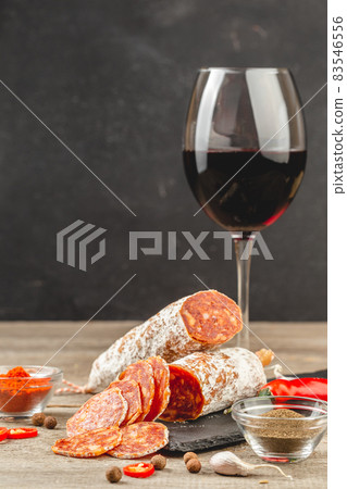 Sliced Chorizo Sausage with a glass of red wine Sliced Chorizo Sausage with a glass of red wine 83546556