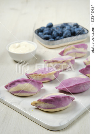Frozen vareniki with blueberry and sour cream 83548484