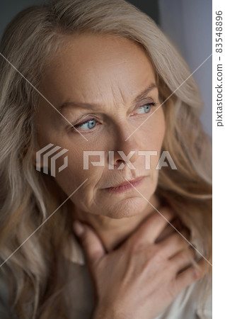 Concerned lovely mature lady staring into the distance 83548896