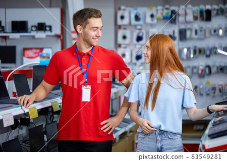 redhead female is looking for the best laptop in computer department redhead female is looking for the best laptop in computer department 83549281