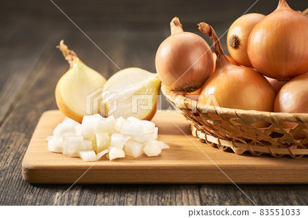 chopped onions on a cutting board. chopped onions on a cutting board. 83551033