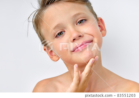smiley little caucasian boy isolated on white studio background with copyspace 83551203