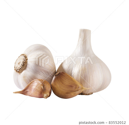 Organic garlic cloves and bulbs isolated on white background. 83552012